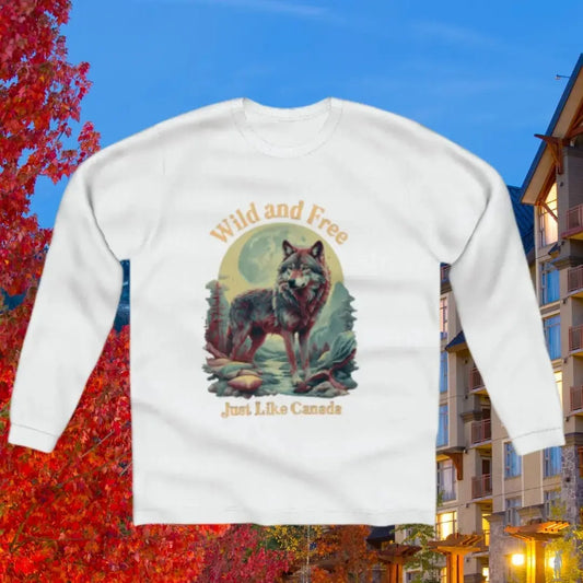 White Canada Wild and Free long-sleeve T-shirt with nature-inspired design, unisex fit, and cozy cotton fabric.