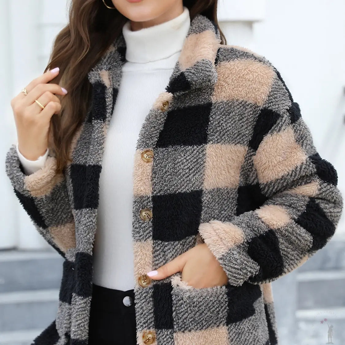 Woman wearing a tan and black checkered coat hand in her pocket