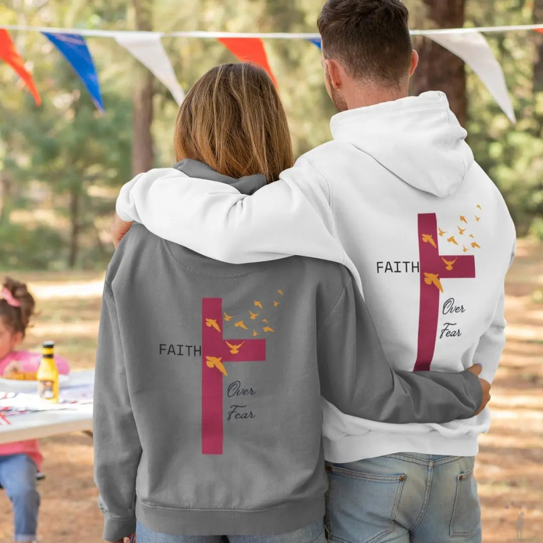 Unisex pullover hoodie with faith-inspired message featuring cross and flying birds