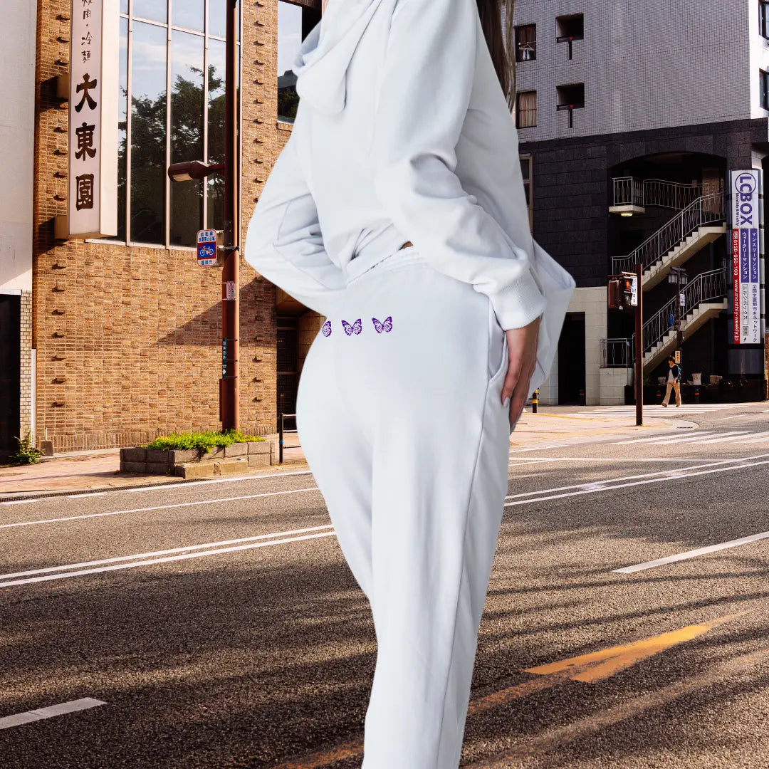 Premium ladies’ joggers with Graceful Faith print, featuring roomy pockets, shaped seams, and elegant butterfly detail - white