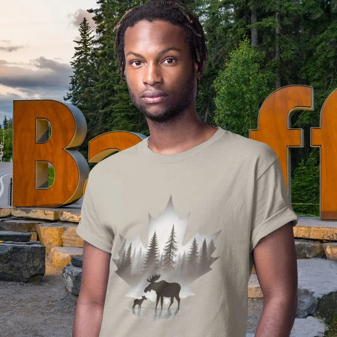 Person wearing a t-shirt with a moose and forest design in front of a large 'Buffalo' sign.