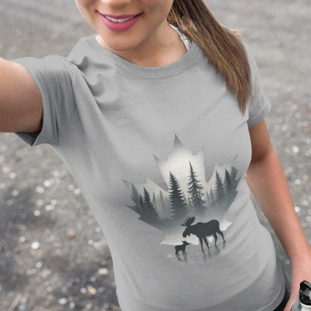 Person wearing a gray t-shirt with a moose and forest design.