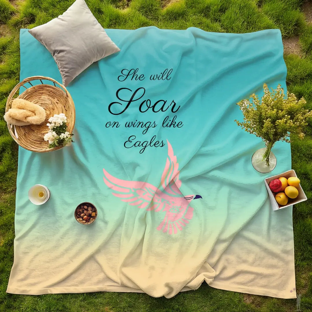 She Will Soar Woman’s Day Blanket with majestic eagle in flight on a blue background. Strength and grace theme, available at Reach Love Connect Boutique