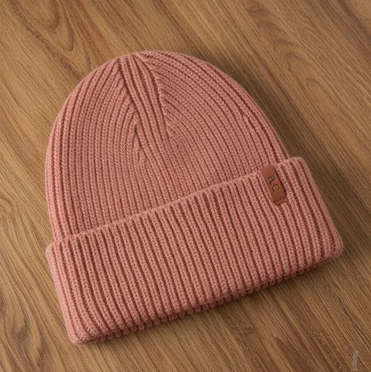 Stylish Pink Knit Hat on display showing soft knit texture and fold-over brim