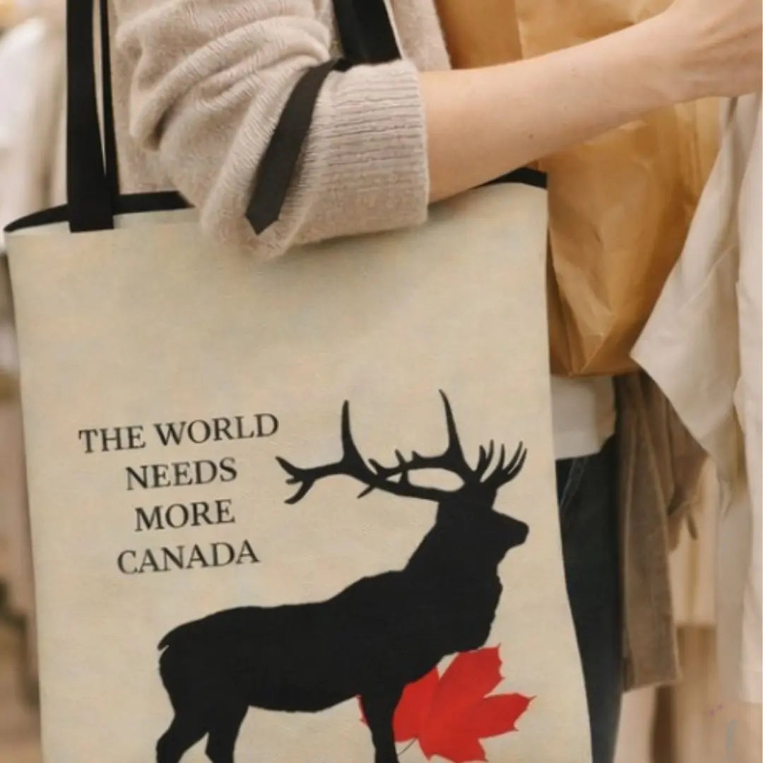 Tote bag with a deer silhouette and text held by a person