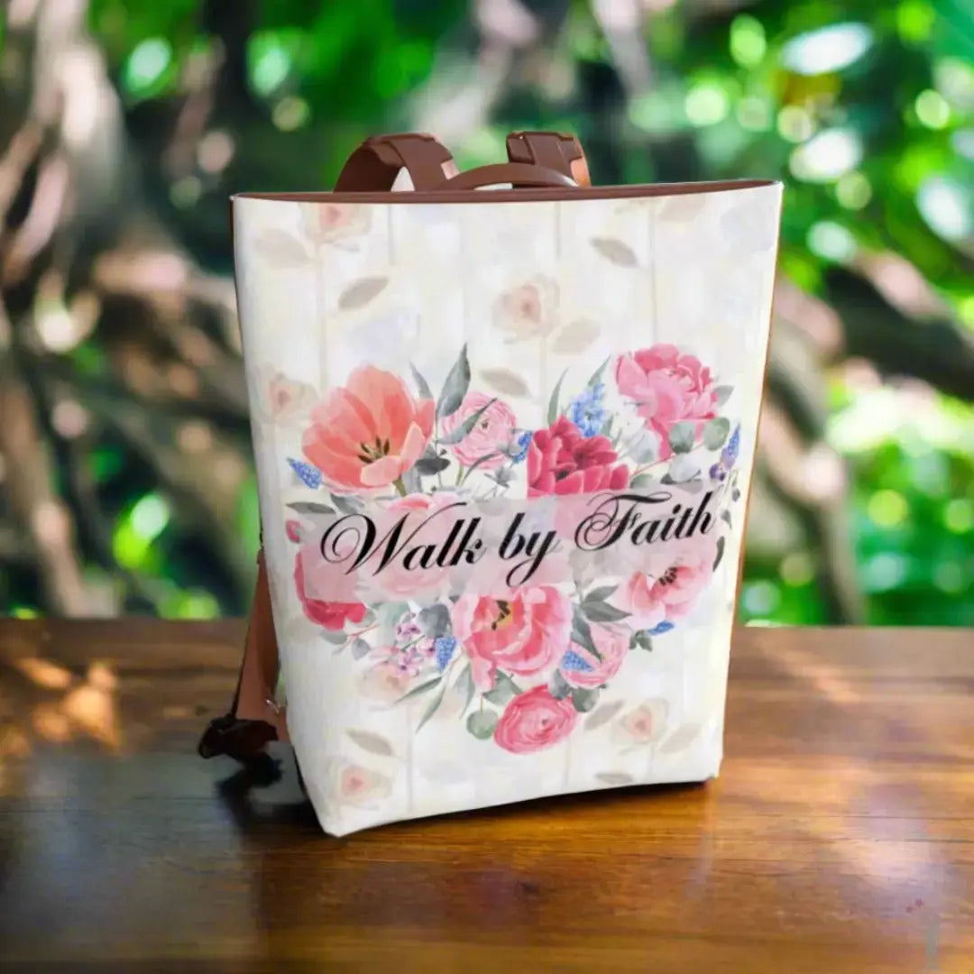 Sustainable Walk by Faith backpack in vegan leather, elegant lettering, roomy compartments, and adjustable straps for comfort.